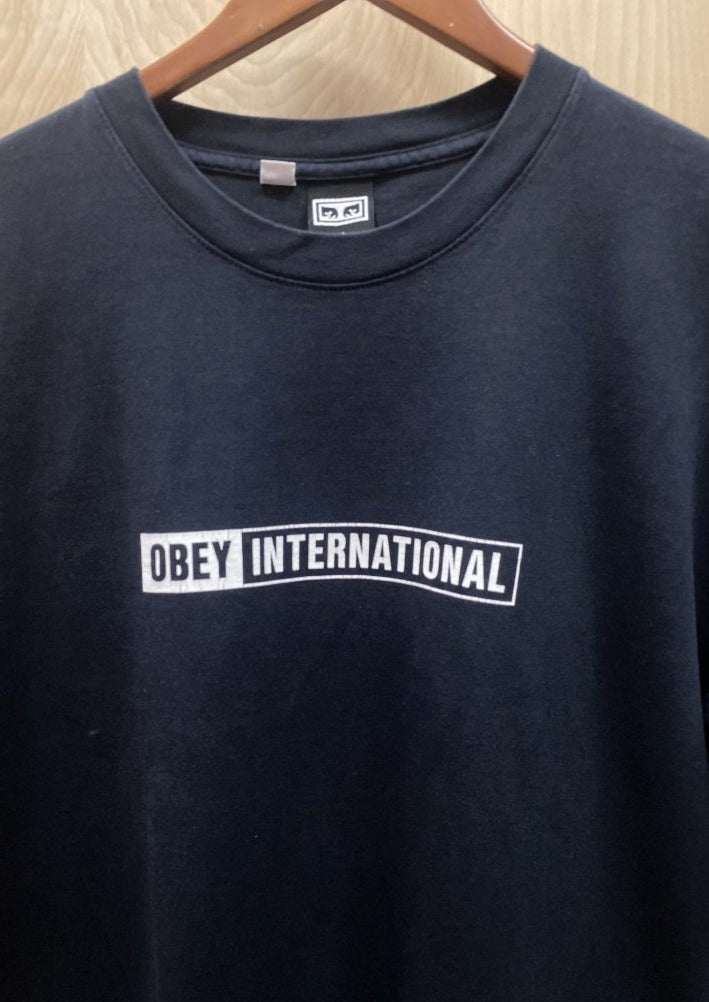 Load image into Gallery viewer, Vintage Obey International T-shirt (6584617631824)
